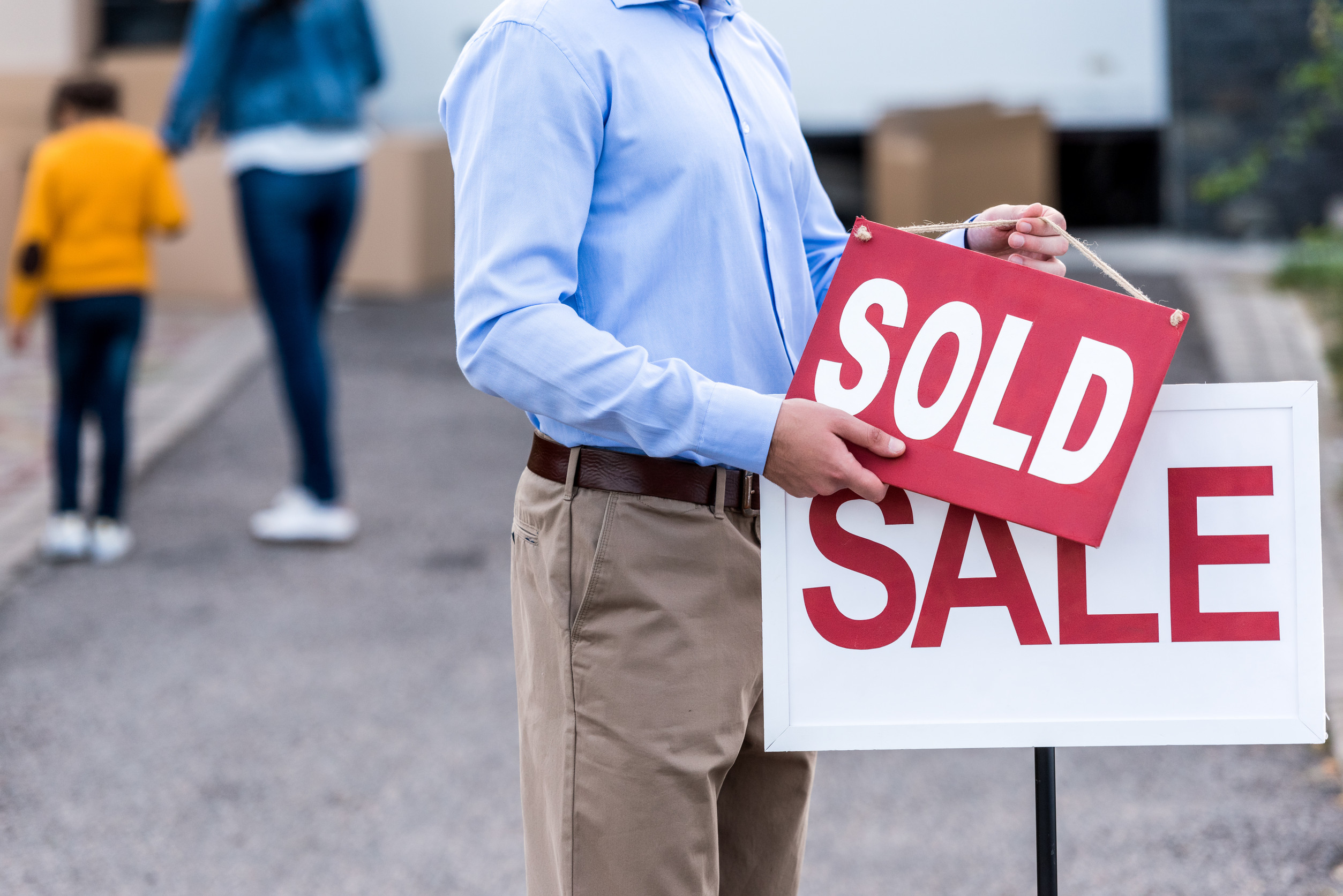 realtor hanging sold sign